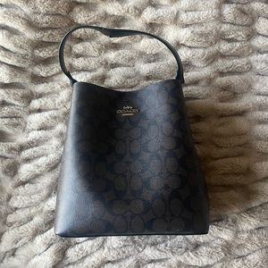 Mollie Bucket Bag 22 In Signature Canvas